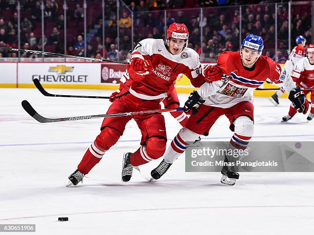 Alexander True of Team Denmark and Jakub Zboril of Team Czech Republic skate after the puck during the 2017 IIHF World Junior Championship...