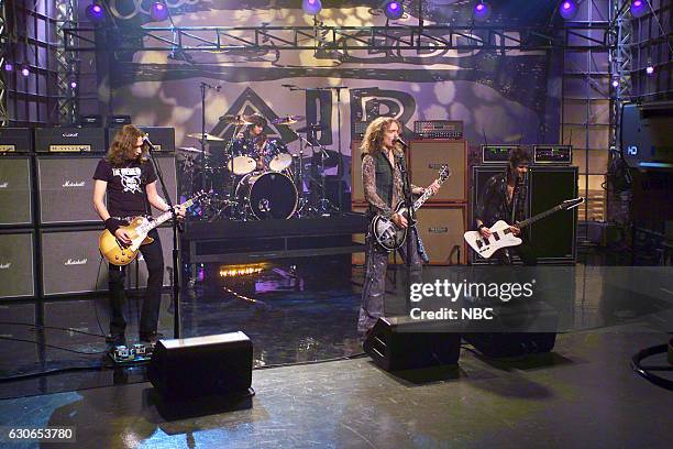 Episode 2692 -- Pictured: Musical guest The Darkness performs on April 19, 2004 --