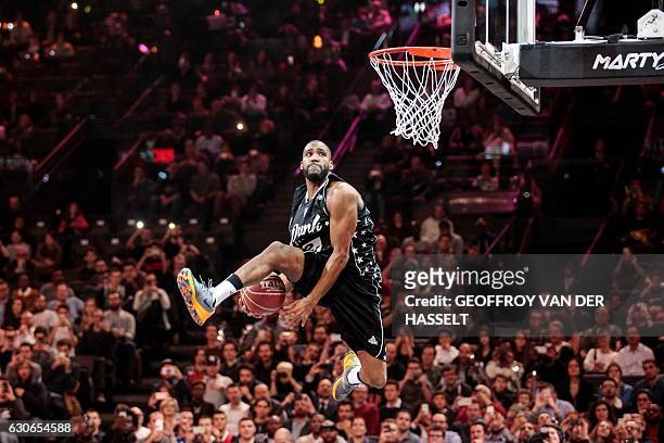 Deonte Burton of US jumps to score during the dunk contest of an All Star Game basketball match of the French Ligue Nationale de Basket between a...