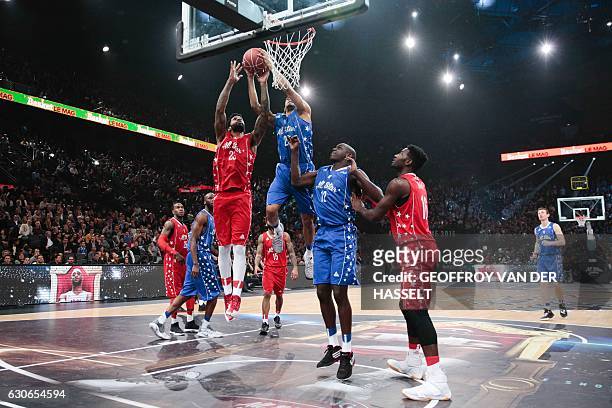 France's David Michineau vies with USA's Cameron Clark during an All Star Game basketball match of the French Ligue Nationale de Basket between a...