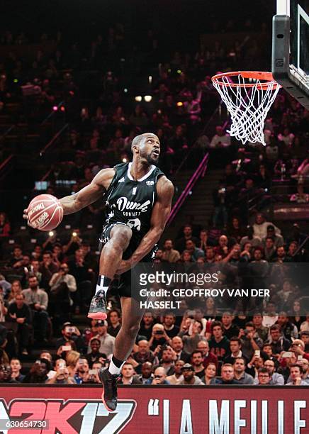 France's Jeremy Nzeulie jumps to score during the dunk contest of an All Star Game basketball match of the French Ligue Nationale de Basket between a...