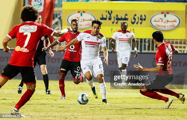 Hossam Ashour of Al Ahly in action against Mohamed Ibrahim of Zamalek during the Egypt Premier League match between Al Ahly and Zamalek at the Petro...