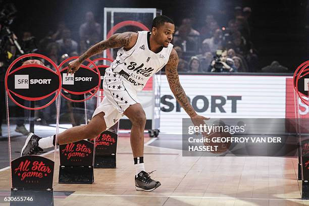 S DJ Cooper participates in a Skills Challenge before an All Star Game basketball match of the French Ligue Nationale de Basket between a selection...