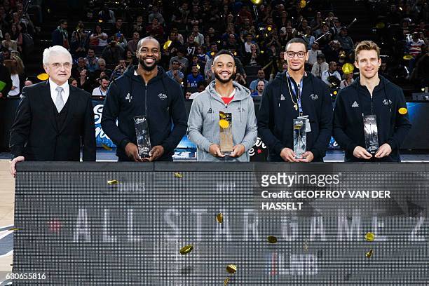 President of the French Ligue Nationale de Basket Alain Beral, France's Jeremy Nzeulie, John Roberson of US, France's Benjamin Sene and Germany's...