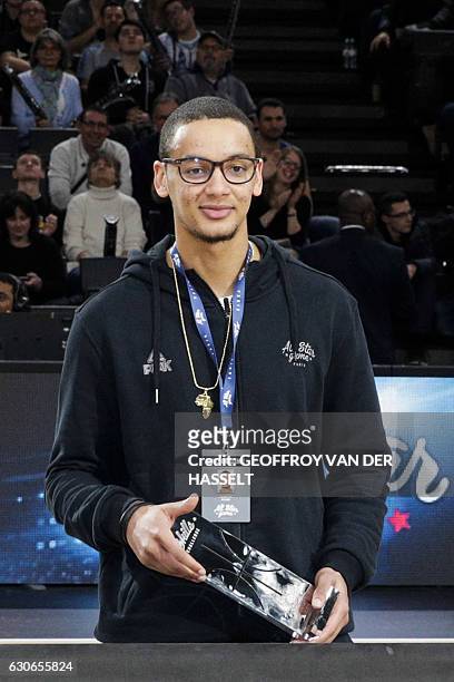 France's Benjamin Sene poses on the podium after winning the Skills Challenge during an All Star Game basketball match of the French Ligue Nationale...