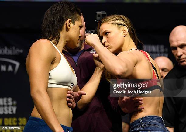 Women's bantamweight champion Amanda Nunes of Brazil and Ronda Rousey face off during the UFC 207 weigh-in at T-Mobile Arena on December 29, 2016 in...