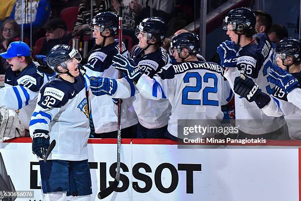 Aapeli Rasanen of Team Finland celebrates a first period goal with teammates on the bench during the 2017 IIHF World Junior Championship preliminary...