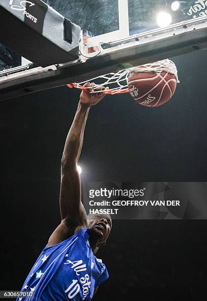 France's Moustapha Fall shoots to score during an All Star Game basketball match of the French Ligue Nationale de Basket between a selection of the...