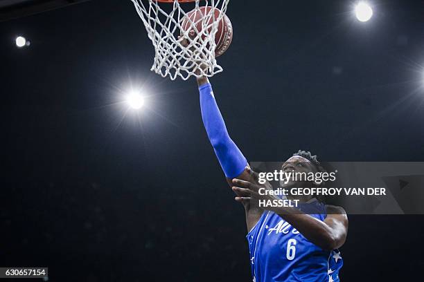 France's Wilfried Yeguete shoots the ball during an All Star Game basketball match of the French Ligue Nationale de Basket between a selection of the...