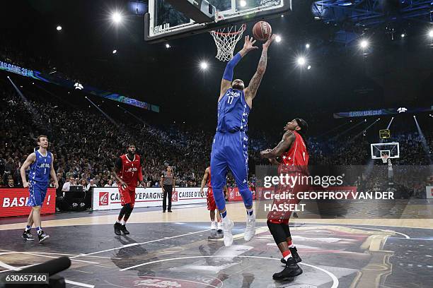 France's Vincent Poirier jumps to shoot the ball during an All Star Game basketball match of the French Ligue Nationale de Basket between a selection...