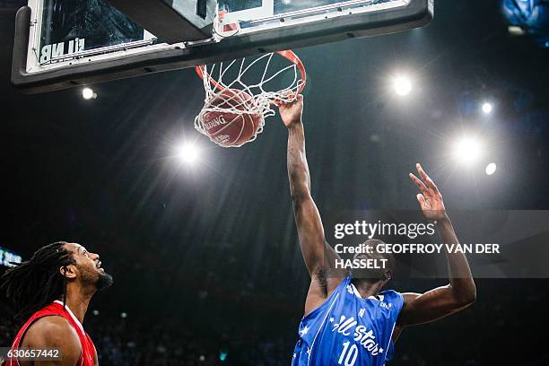 France's Moustapha Fall shoots to score during an All Star Game basketball match of the French Ligue Nationale de Basket between a selection of the...