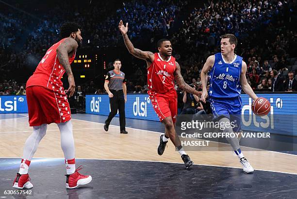 France's Edouard Choquet vies for the ball with DJ Cooper from US during an All Star Game basketball match of the French Ligue Nationale de Basket...