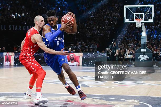 France's Wilfried Yeguete vies with Ukraine's Sergii Gladyr during an All Star Game basketball match of the French Ligue Nationale de Basket between...