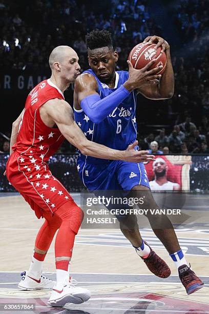 France's Wilfried Yeguete vies with Ukraine's Sergii Gladyr during an All Star Game basketball match of the French Ligue Nationale de Basket between...