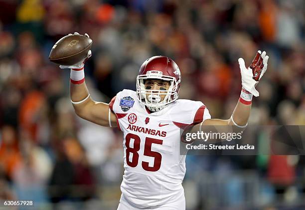 Cheyenne O'Grady of the Arkansas Razorbacks reacts after catching a touchdown pass against the Virginia Tech Hokies during the Belk Bowl at Bank of...