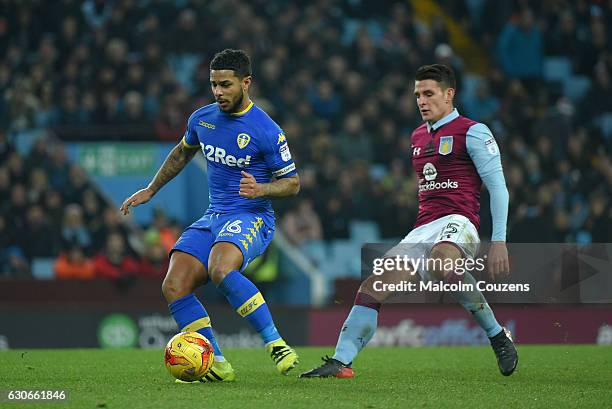 Liam Bridcutt of Leeds United competes with Ashley Westwood of Aston Villa during the Sky Bet Championship match between Aston Villa and Leeds United...