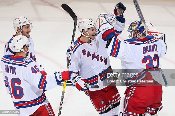 Matt Puempel of the New York Rangers celebrates with goaltender Antti Raanta following the NHL game against the Arizona Coyotes at Gila River Arena...