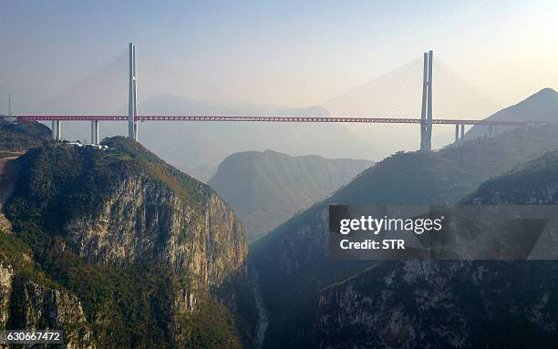 This picture taken on December 28, 2016 shows the Beipanjiang Bridge, near Bijie in southwest China's Guizhou province. The world's highest bridge...