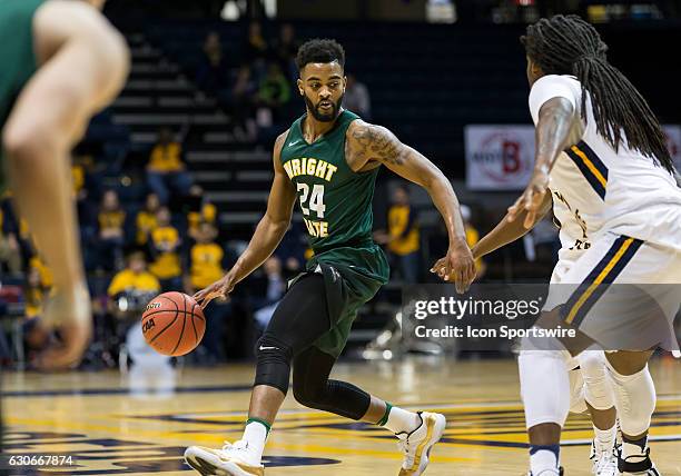 Wright State guard Mark Alstork makes a move around Murray State forward Terrell Miller Jr during an NCAA basketball game between the Murray State...