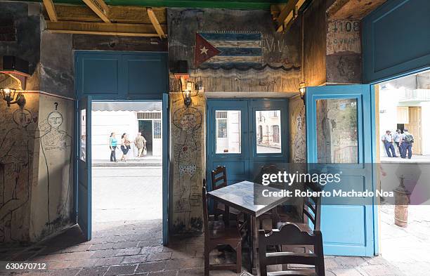 Cuba Travel and Tourism: Bar "El Cambio" in the Ignacio Agramonte plaza or square. The traditional drinking establishment is a popular landmark and...