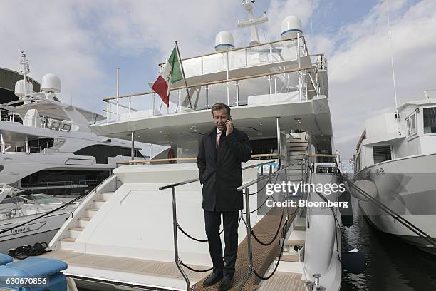Vassili Fotilas, commercial director Europe at Fraser Yachts Florida Inc., stands on the stern deck of a Benetti BF103 yacht at the Azimut Benetti...