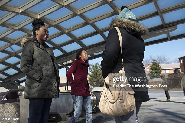 Cali Edmonds and Shalesha Majors, with the Women's Collective, reach out to women near Benning Road Metro in Washington, D.C., about HIV testing and...