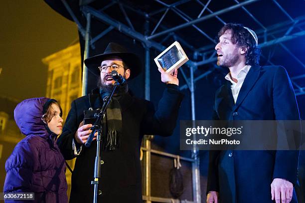 Rabbi Menachem Evers and Spanish/Dutch actorJavier Guzman at the Dam Square in Amsterdam on December 29, 2016 to celebrate Hanukkah, also known as...