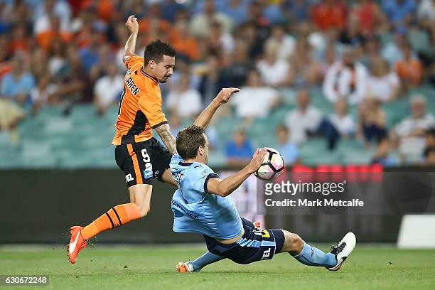 Jamie Maclaren of the Roar has a shot blocked by Alex Wilkinson of Sydney FC during the round 13 A-League match between Sydney FC and Brisbane Roar...