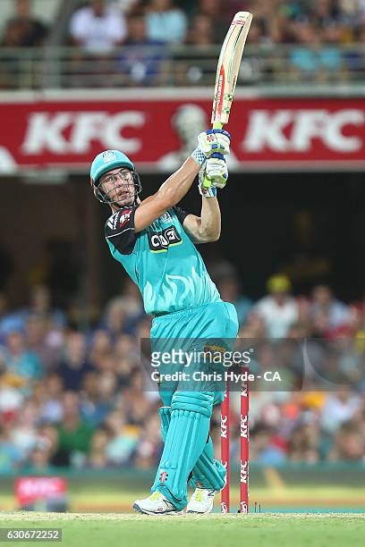 Chris Lynn of the Heat bats during the coin toss before the Big Bash League between the Brisbane Heat and Hobart Hurricanes at The Gabba on December...