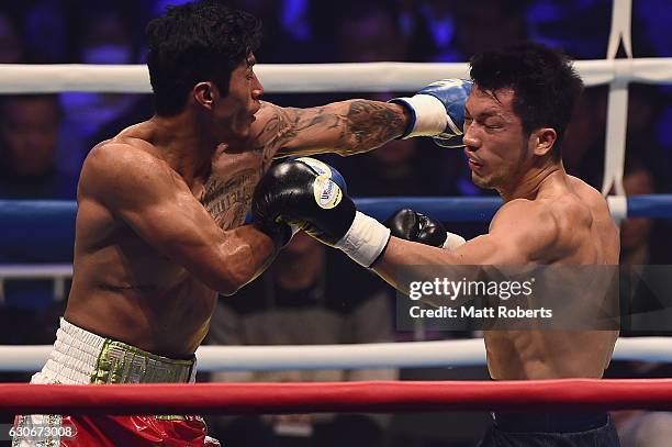 Ryota Murata punches Bruno Sandoval during the non-title bout between Ryota Murata and Bruno Sandoval at the Ariake Colosseum on December 30, 2016 in...