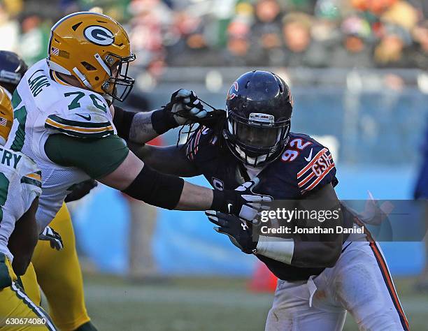 Pernell McPhee of the Chicago Bears rushes against T.J. Lang of the Green Bay Packers at Soldier Field on December 18, 2016 in Chicago, Illinois. The...