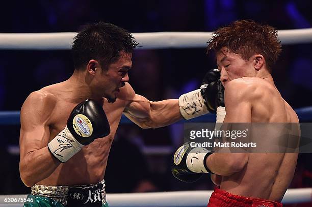 Kohei Kono punches by Naoya Inoue during the WBO World Super Flyweight Title bout between Naoya Inoue and Kohei Kono of Japan at the Ariake Colosseum...