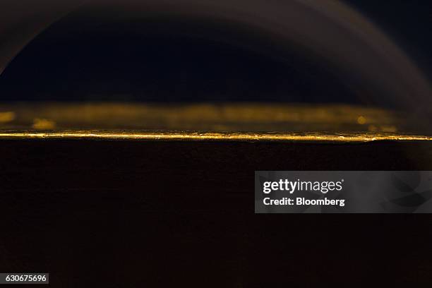 Light illuminates the edge of a gold ingot on display inside the Deutsche Bundesbank's money museum in Frankfurt, Germany, on Thursday, Dec. 29,...