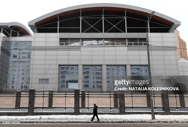 Man walks past the building of the headquarters of the Russian General Staff's Main Intelligence Department in Moscow on December 30, 2016. Russia's...