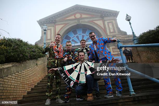 Darts fans arrive at Alexandra Palace in fancy dress ahead of the quarter finals of the 2016 William Hill World Darts Championship on December 30,...