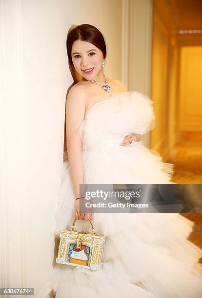 Wendy Yu attends the 62nd anniversary of the International Debutante Ball in the Grand Ballroom of The Pierre in New York City wearing a haute...