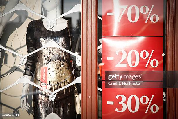 Shop window with ads for discounts is seen on December 30, 2016 in Bydgoszcz, Poland. Bydgoszcz is the eighth-largest city in Poland.