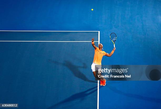 Rafael Nadal of Spain in action against Milos Raonic of Canada during day two of the Mubadala World Tennis Championship at Zayed Sport City on...