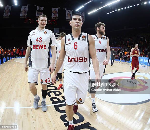 Nikos Zisis, #6 of Brose Bamberg, Patrick Heckmann, #33 of Brose Bamberg and Nicolo Melli, #4 of Brose Bamberg celebrate victory during the 2016/2017...