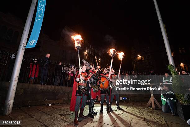 Men dressed as vikings take part at a photocall before participating in the Torchlight Procession during Edinburgh's Hogmanay celebrations on...