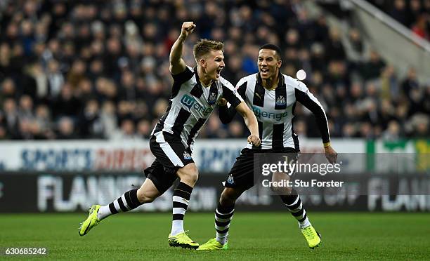 Newcastle player Matt Ritchie celebrates his opening goal with Isaac Hayden during the Sky Bet Championship match between Newcastle United and...