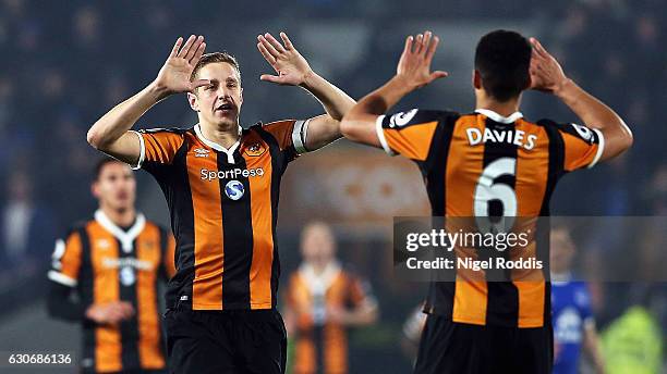 Michael Dawson of Hull City celebrates scoring the opening goal with Curtis Davies of Hull City during the Premier League match between Hull City and...