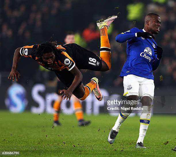 Dieumerci Mbokani of Hull City is challenged by Enner Valencia of Everton during the Premier League match between Hull City and Everton at KCOM...