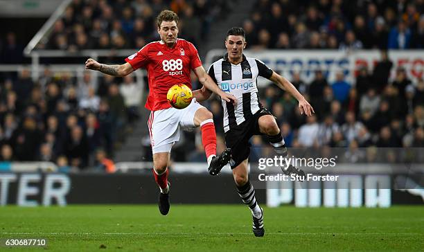 Nicklas Bendtner challenges Ciaran Clark of Newcastle during the Sky Bet Championship match between Newcastle United and Nottingham Forest at St...