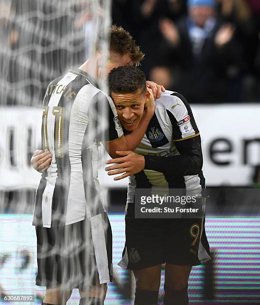Dwight Gayle of Newcastle celebrates with Matt Ritchie after scoring the third Newcastle goal during the Sky Bet Championship match between Newcastle...