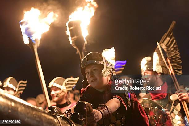 Boy dressed as Viking takes part in the torchlight procession as it makes its way through Edinburgh for the start of the Hogmanay celebrations on...