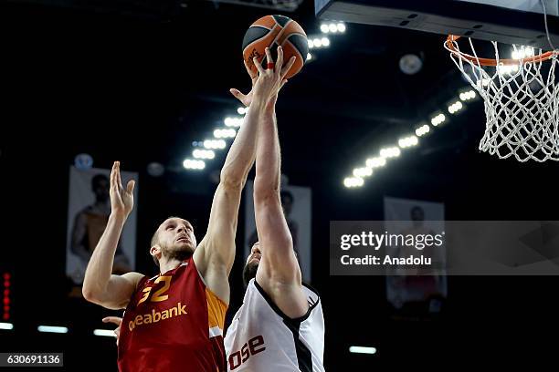 Sinan Guler of Galatasaray Odeabank in action against Vladimir Veremeenko of Brose Bamberg during Euroleague basketball match between Galatasaray...