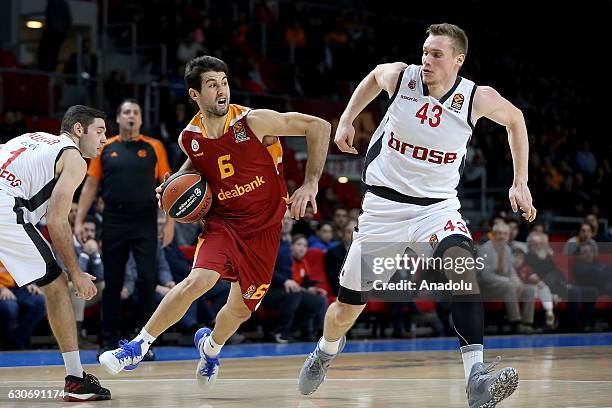 Bruno Fitipaldo of Galatasaray Odeabank in action against Leon Radosevic of Brose Bamberg during Euroleague basketball match between Galatasaray...