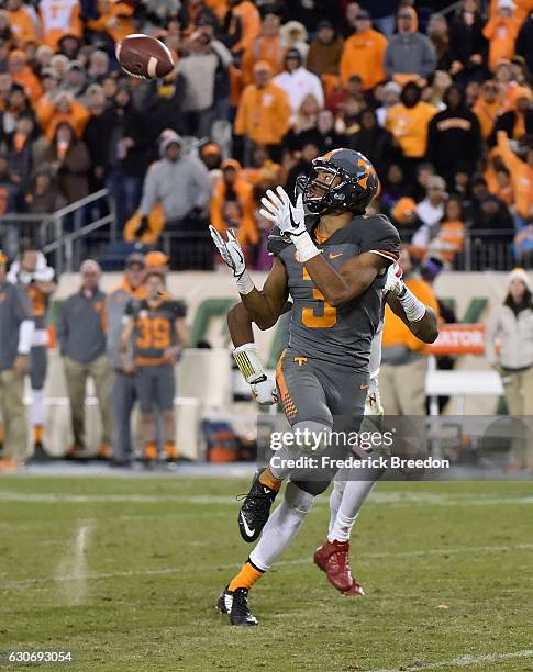 Josh Malone of the University of Tennessee Volunteers catches a 59 yard touchdown pass against the Nebraska Cornhuskers during the second half of the...
