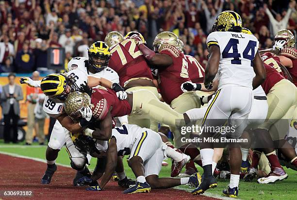 Dalvin Cook of the Florida State Seminoles scores a touchdown in the first quarter against the Michigan Wolverines during the Capitol One Orange Bowl...